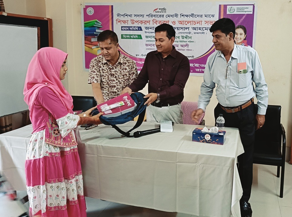 Education material distribution among the girls students under PEER at Godagari area